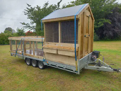 A chicken coop arrived, ready for unloading.