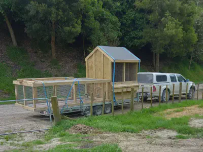 A chicken coop ready and loaded for delivery.