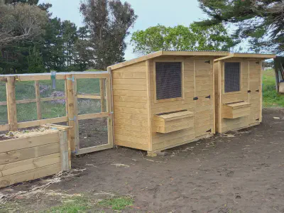 Two hen houses with attached run.